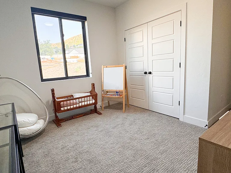 3rd floor bedroom with East facing mountain views.