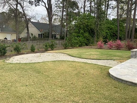 Backyard with new sod and fire pit