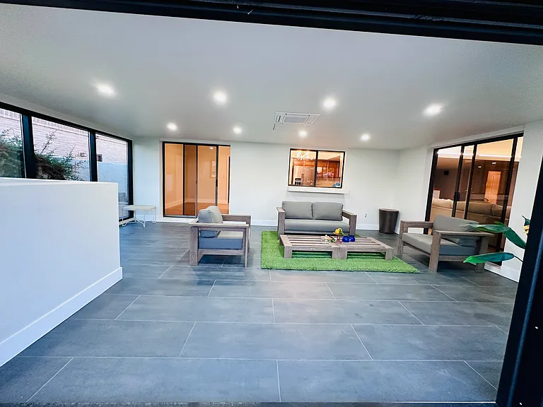Nice, big indoor patio with expansive glass door.