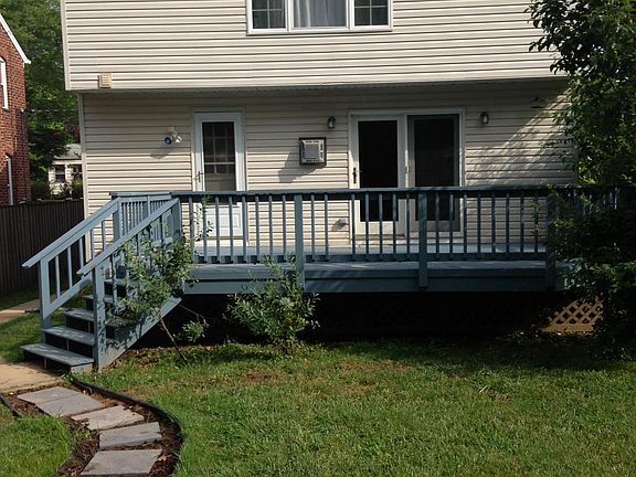 Back of house with deck