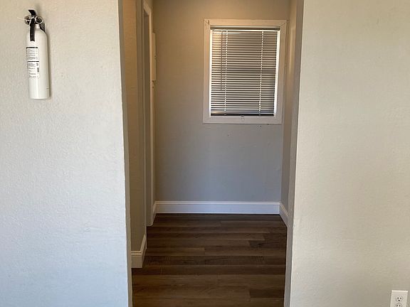 hallway off of living room leading to bath and bedroom