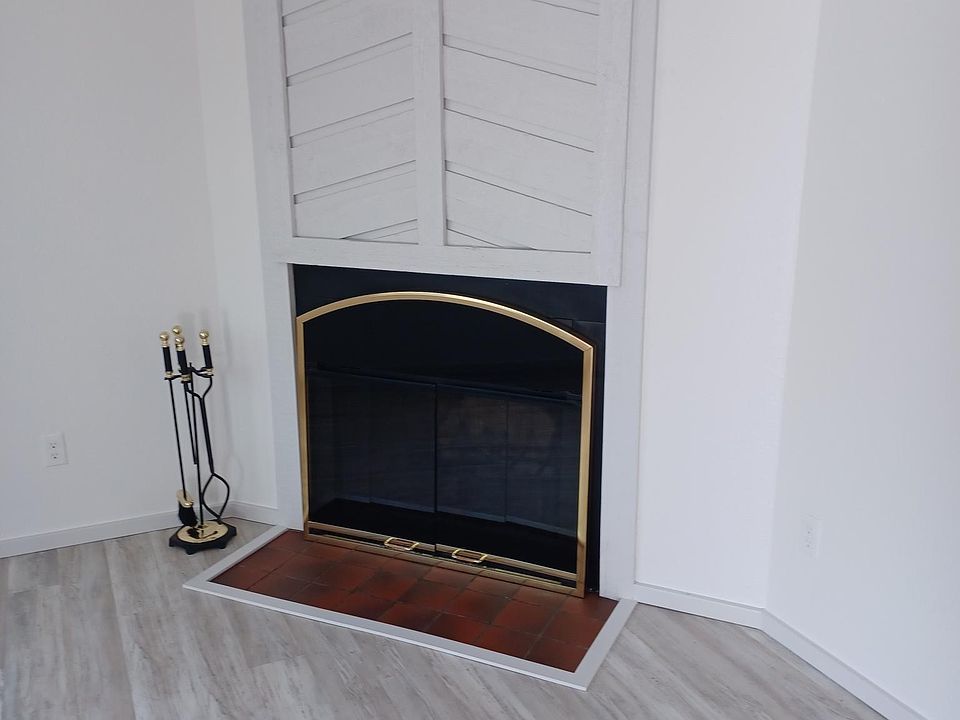 Living room fireplace shows plank easy to maintain vinyl.