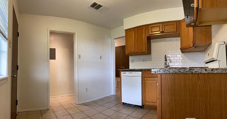 kitchen view toward the washer and driver closet