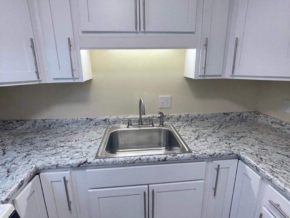 Updated kitchen! Brand New Cabinets, Counter Top, Faucet & Sink!