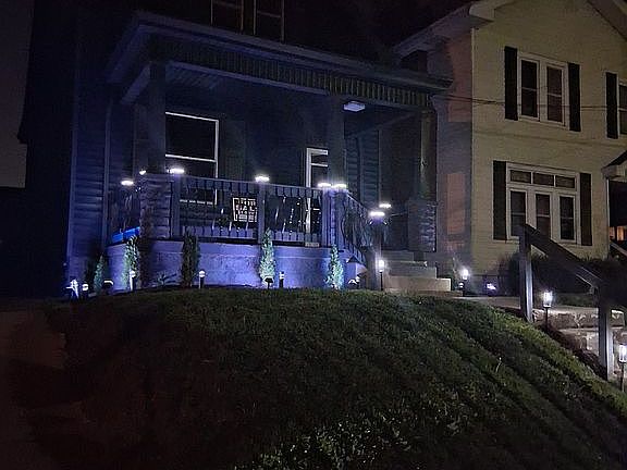 front of the house at night 