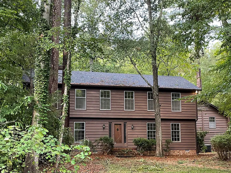 Nestled in a ~1 acre wooded lot with large front and back yards.