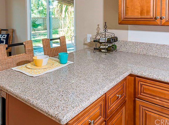 The large breakfast bar which backs to the family room and has natural lighting streaming in from th