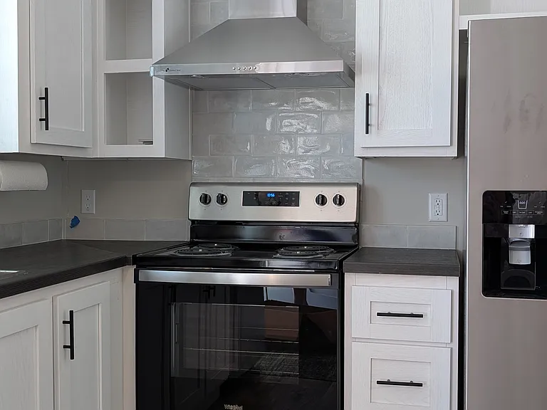 Beautiful kitchen with stainless appliances.