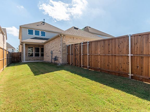 New Construction Spacious, fenced-in backyard with covered patio.