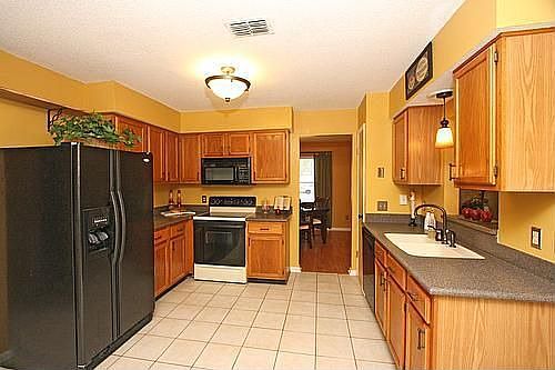 Kitchen wtih Corian counters