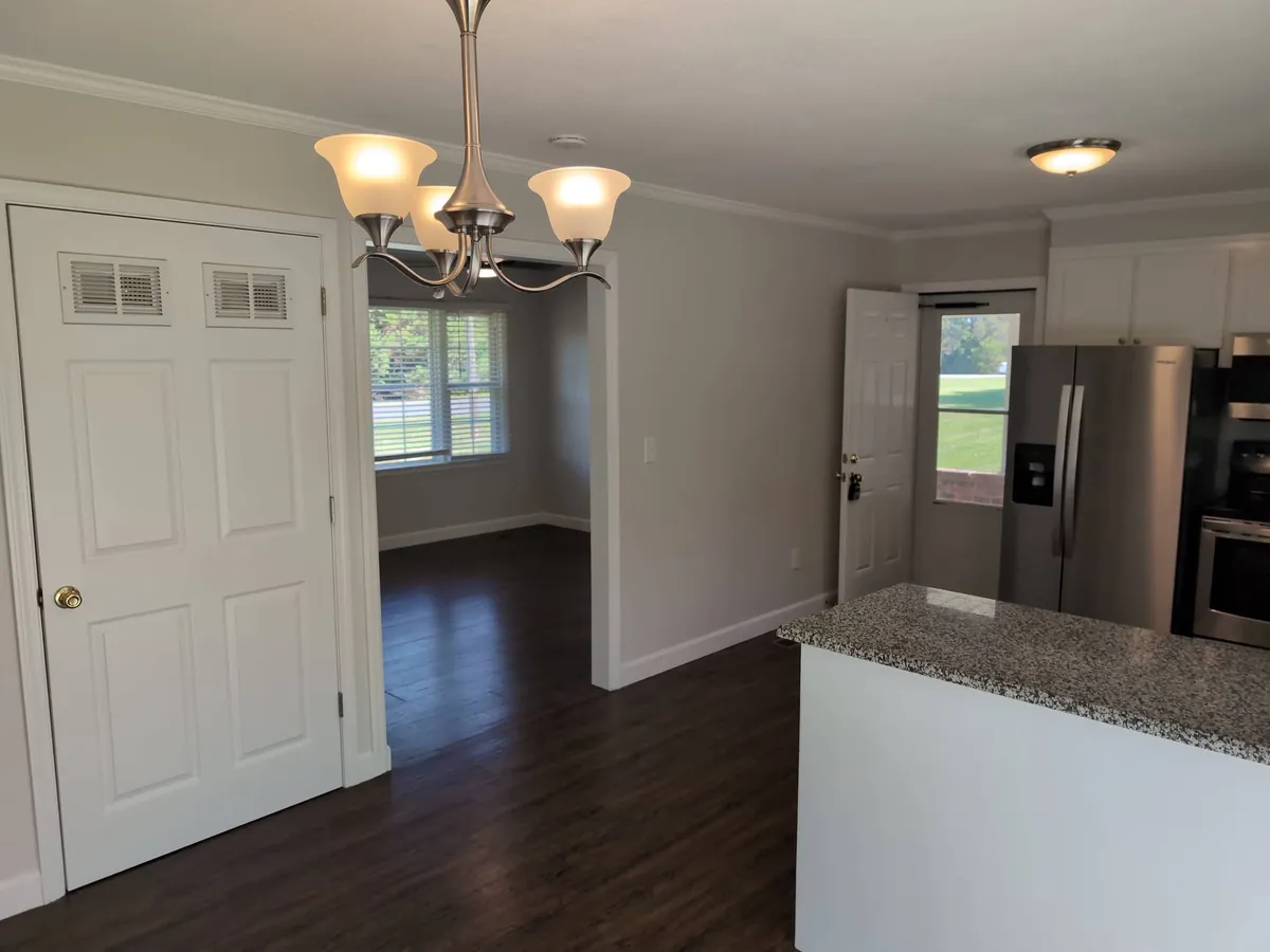 Dining room looking into living room and kitchen - 641 Anna Dr