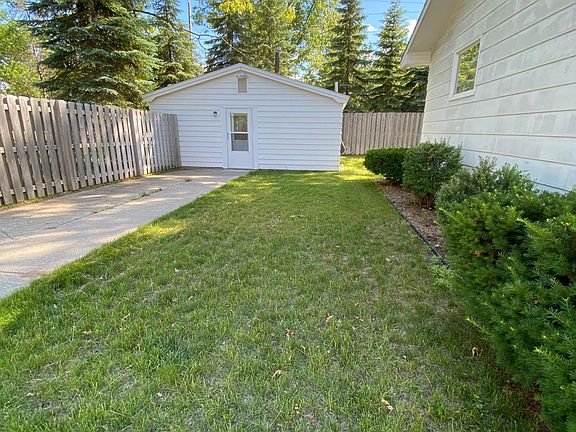 East side yard & included accessory building.