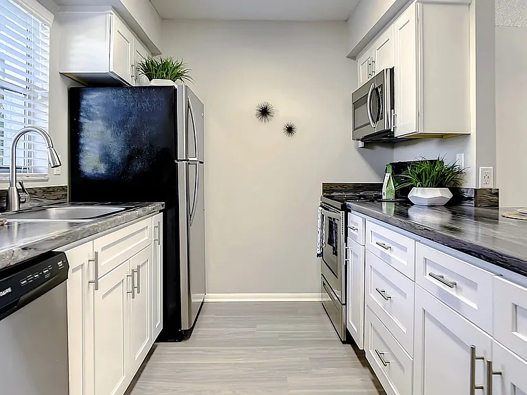Feel the joy cooking in this sleek, galley kitchen.