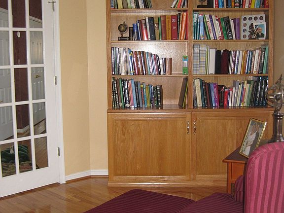 Study with Built in custom shelving w/hardwood and deck off study