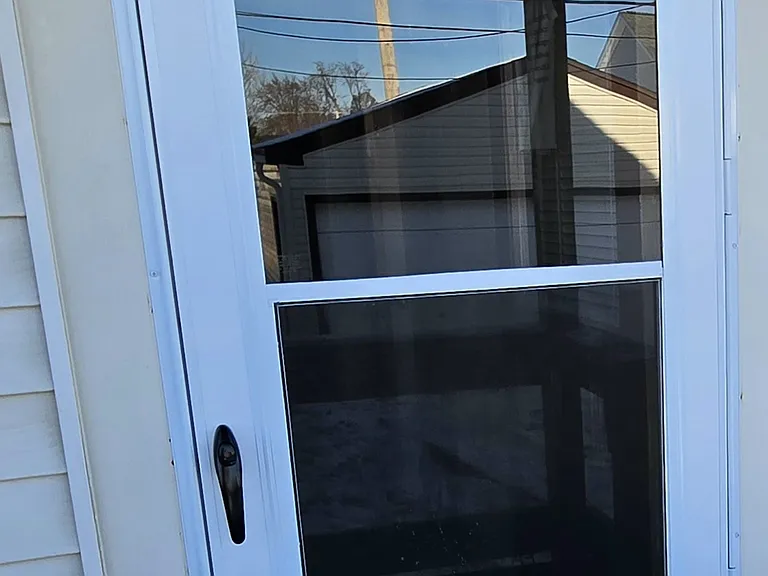 Storm/Screen door in back bedroom