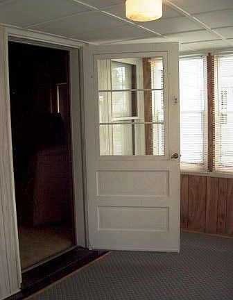 Enter through Enclosed Front Porch