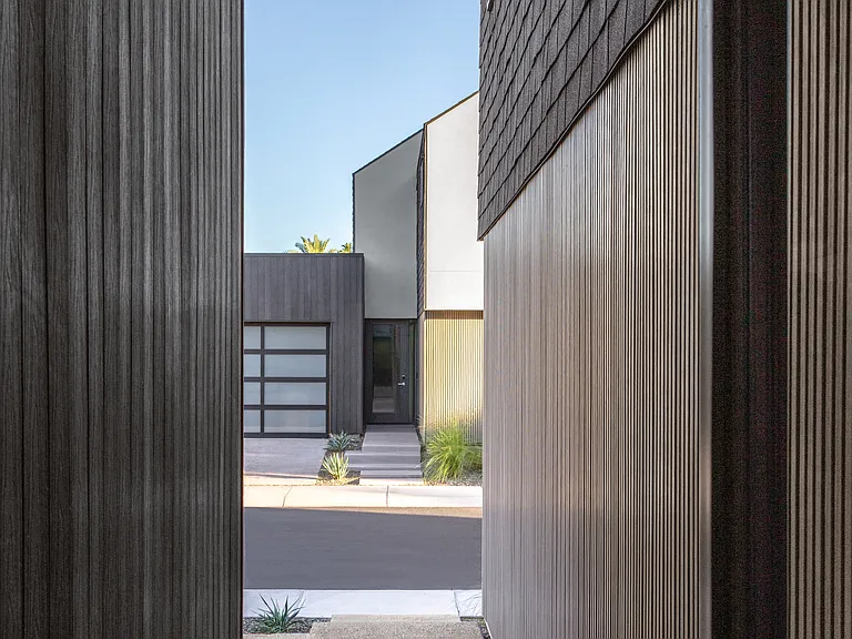 A quiet, sheltered entry experience designed to create privacy, security, and a sense of arrival.