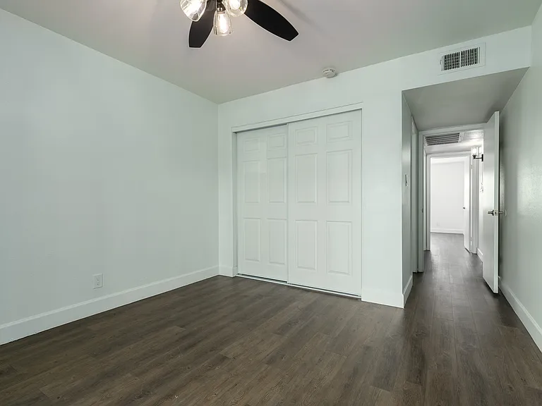 Primary Bedroom with ceiling fan and ensuite bath