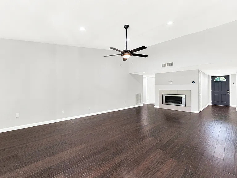 Another view of this spacious living room and fireplace.