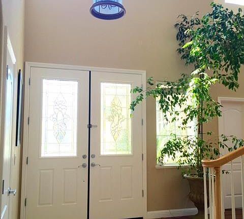 Close-up view of teh front door and entry base.