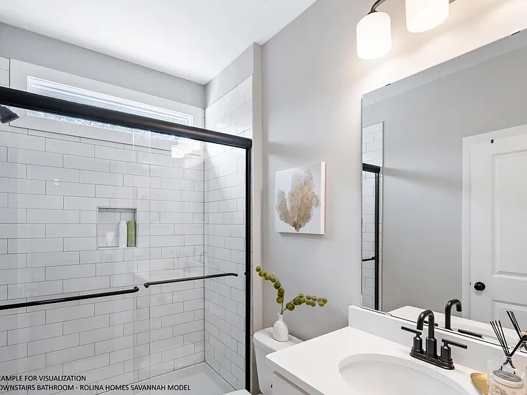 DOWNSTAIRS BATHROOM PICTURE FROM A DIFFERENT SAVANNAH MODEL RECENTLY BUILT BY ROLINA HOMES