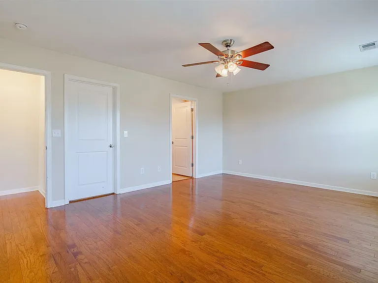 Beautiful large primary suite on the main level of the home with large closet and bathroom.