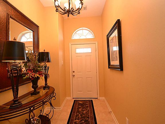 Elegant entry offering tile floors and raised ceilings.
