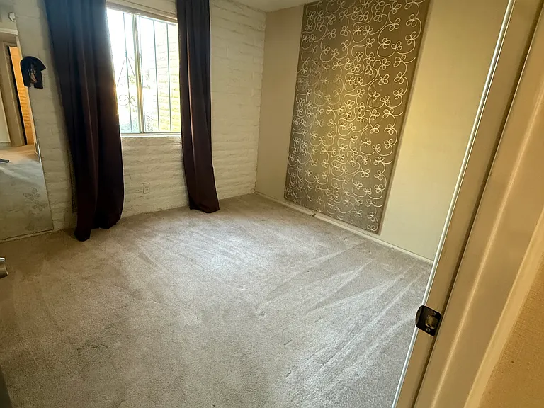Second bedroom also has a dimmable ceiling fan and thermal curtains to reduce energy costs.