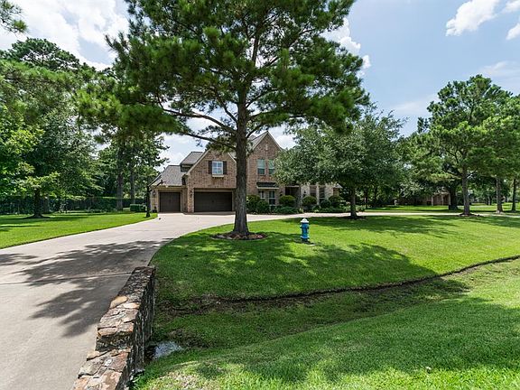 Situated on over an acre sits this pristine estate featuring circular driveway.