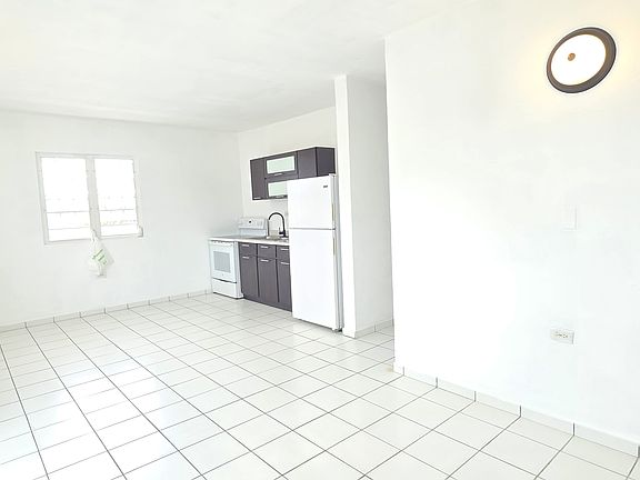 Similar angle/view of kitchen and dining area.