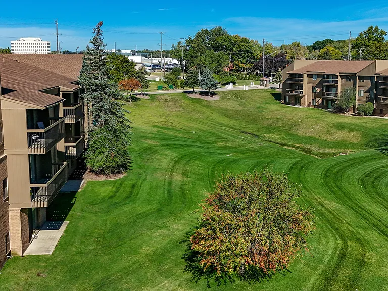 Expansive Green Space Apartment Building Exterior at Franklin River Apartments, Southfield, MI