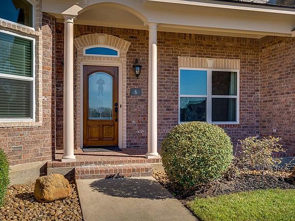 Covered front entrance with sitting porch
