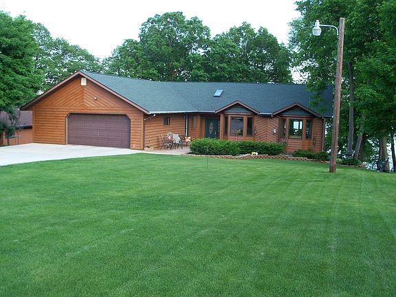 Attached garage with cement driveway