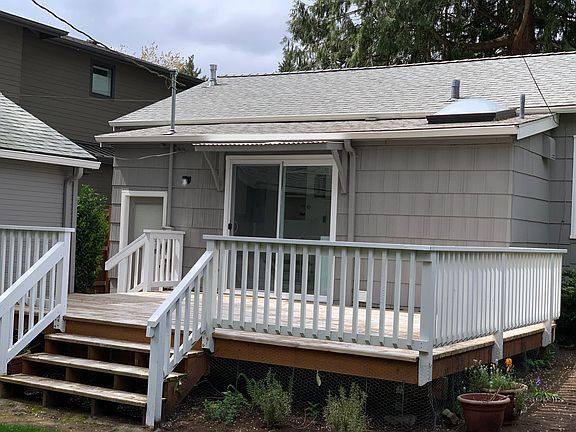 Spacious back deck for enjoying the peaceful backyard and outdoor living