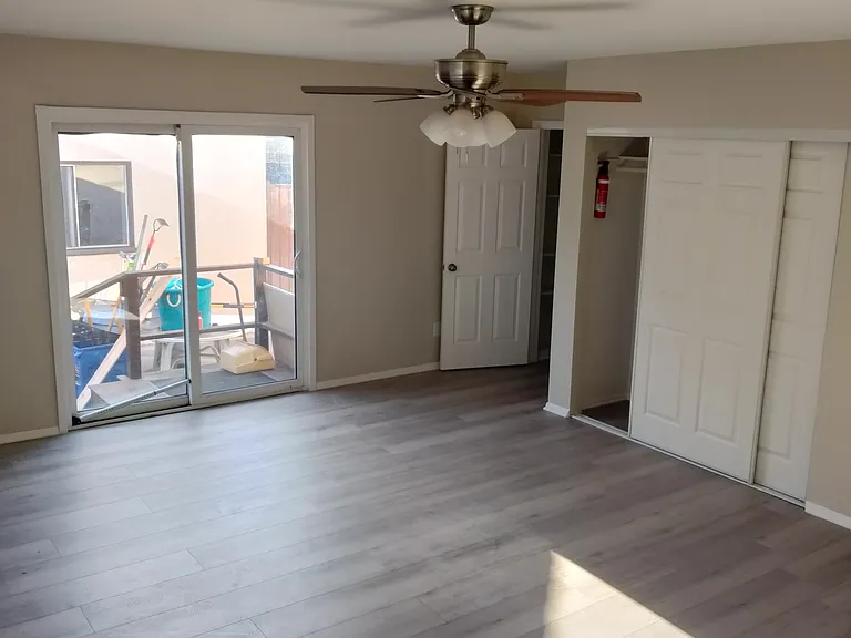 Master Bedroom screen sliding door with access to patio connecting to the garage and back yard
