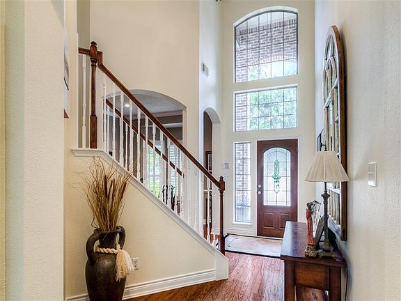 Beautiful hardwood flooring runs through the entire 1st floor and.......