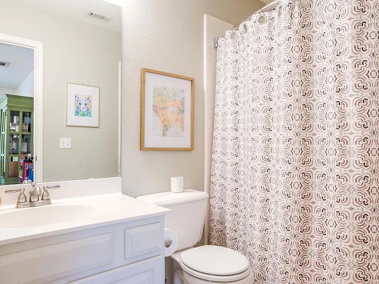 Bathroom outside of second bedroom. Shower/tub combo