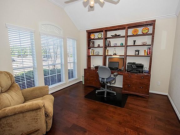 Double French doors lead to the study off the Foyer.  Recent hardwood flooring and new built-ins complete this beautiful space!