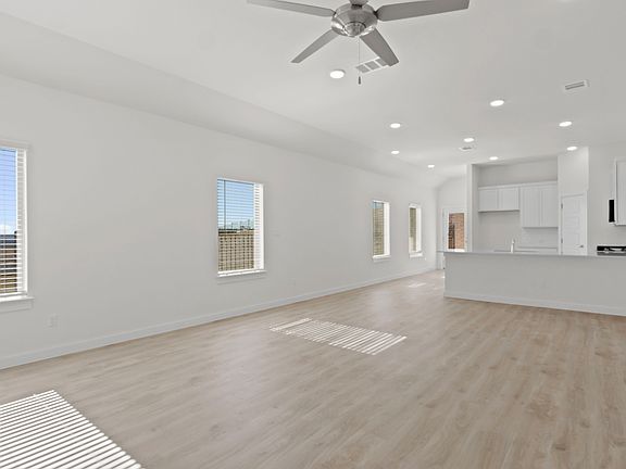 Living Room in the Pecan II home plan by Trophy Signature Homes - REPRESENTATIVE PHOTO