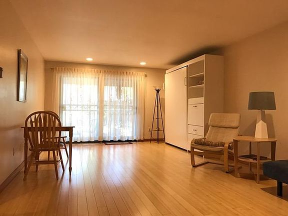 Open living room floor plan with bamboo floors