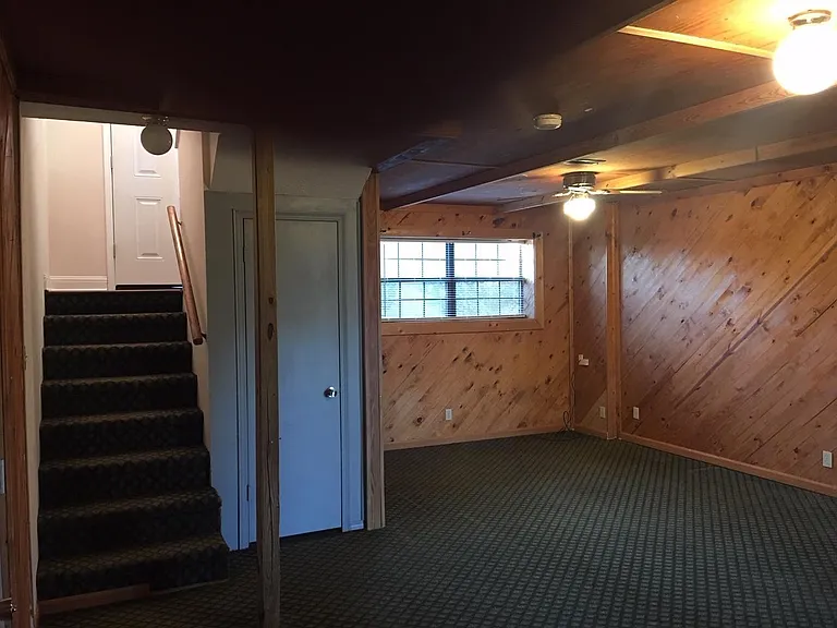 Large Lower level Family Room with garage entry