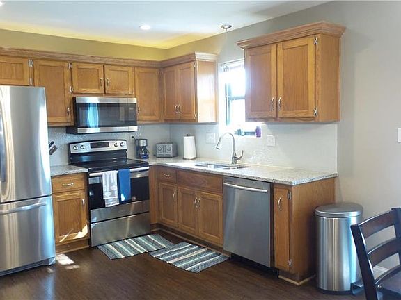 Kitchen has up graded lighting, new appliances, granite counter tops and glass back splash.