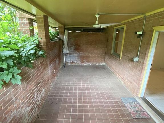Private enclosed porch with entry to the apartment on the right