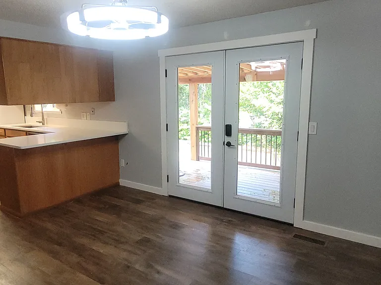New french doors lead to new covered deck