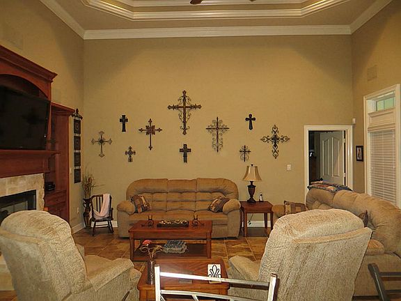 In Kitchen Looking into Living Room. Has Tiered Ceiling,, Crown Molding and Porcelain Tiles.