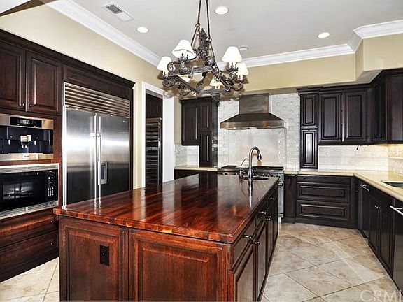 Beautiful kitchen with large center island and veggie sink, sub-zero frig, full sized wine frig, mie