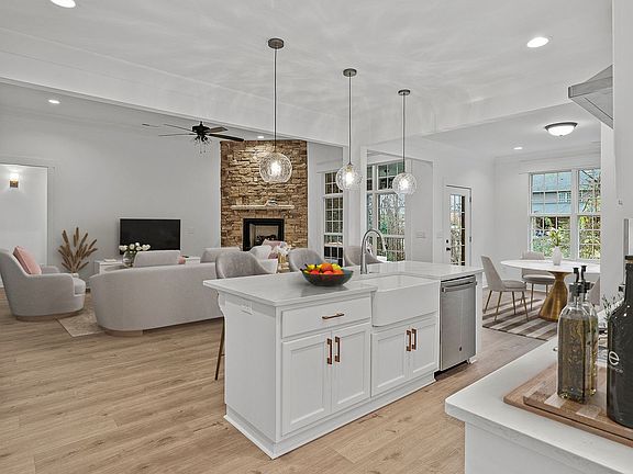 Gourmet kitchen with custom painted cabinets, quartz countertops, upgraded stainless steel appliance