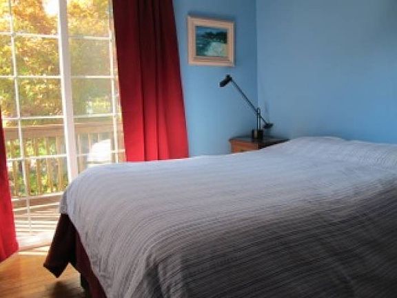 Bedroom with Doors to Bac