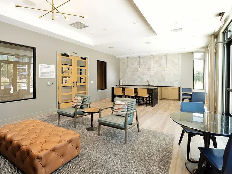 Resident lounge with seating and kitchenette