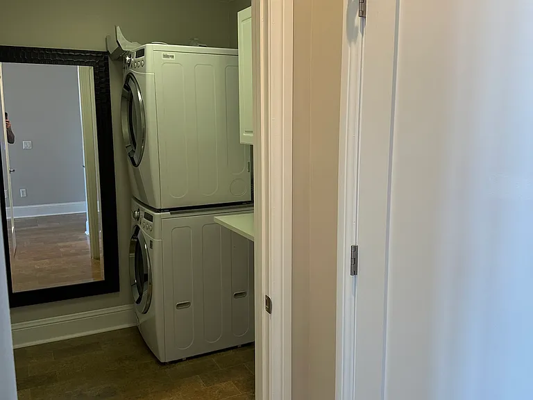 Laundry Room with Stackable Washer and Dryer